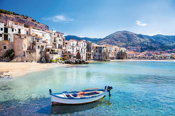 Old harbor with wooden fishing boat in Cefalu, Sicily