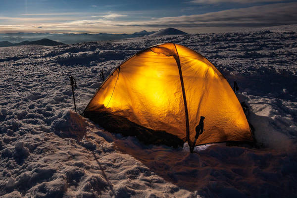 496261236 Camping during winter hiking in Carpathian mountains