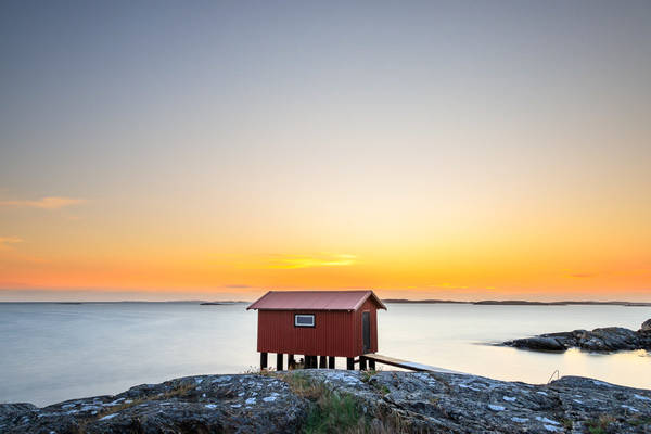 a colorful sunset at the cliffs of Smögen in Sweden