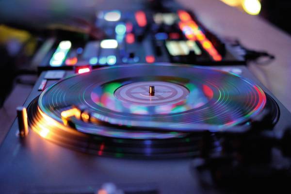 CLOSE-UP OF ILLUMINATED PIANO