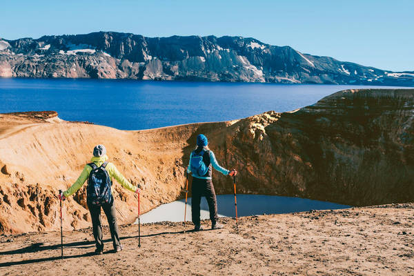 KX4HY8 hikers looking at Geothermal crater lake near the Askja volcano, Iceland