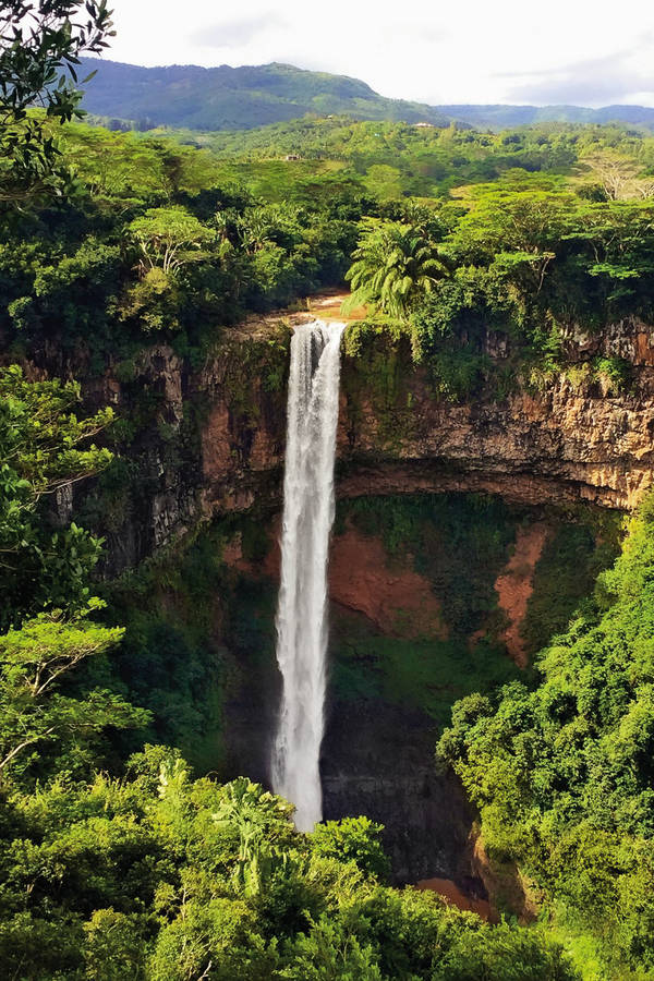 672269037 River Flowing Through Rocks