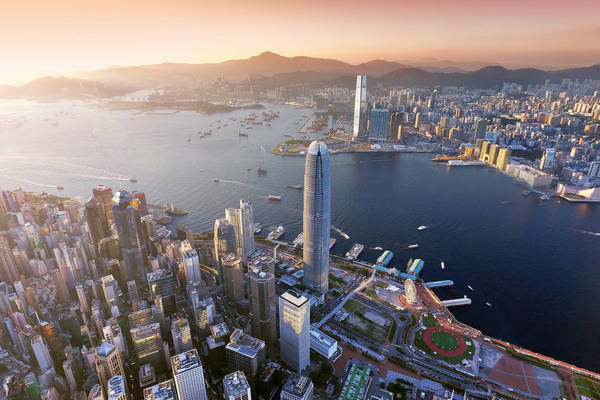 594050928 Aerial view of Hong Kong city, Victoria harbour in sunset
