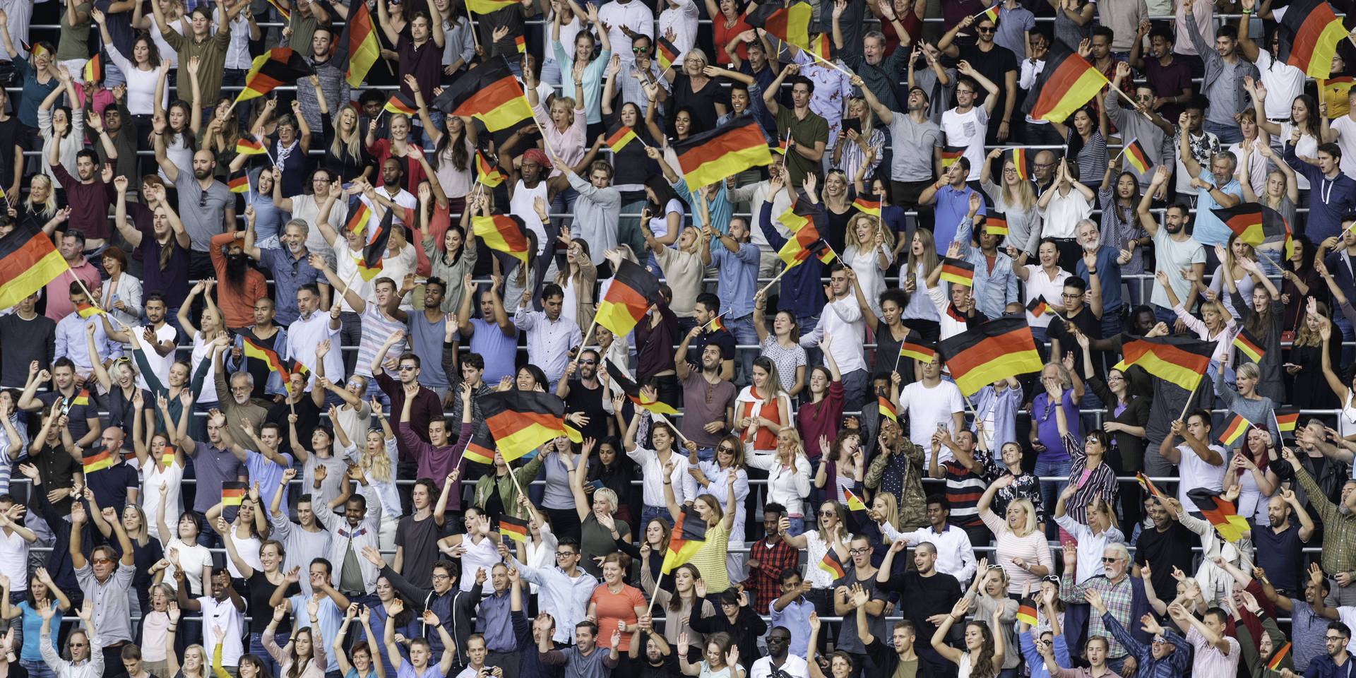 Germany supporters waving their flags on a stadium