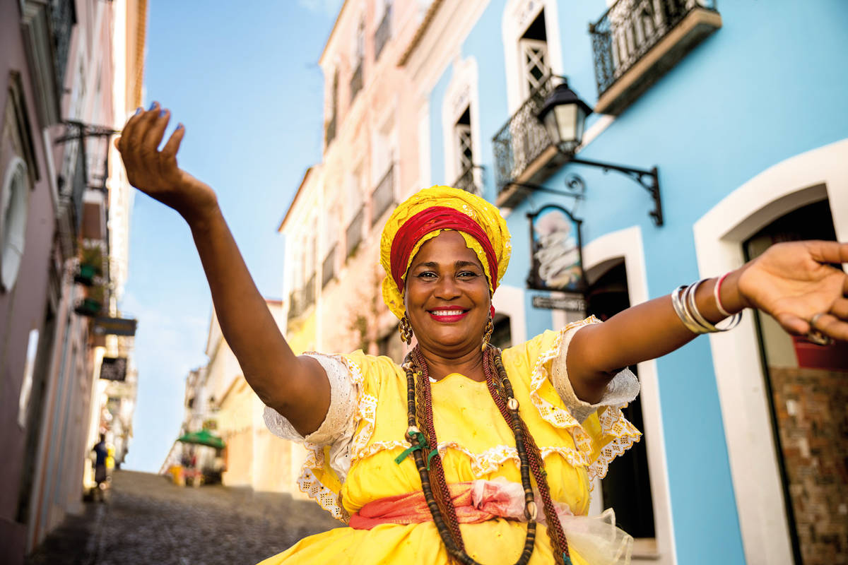 Beautiful Brazilian woman "Baiana" with local costume in Pelourinho, Salvador, Bahia